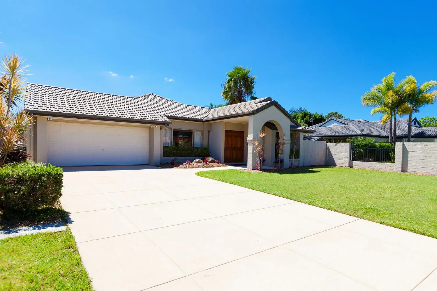 Concrete driveway leading to a home