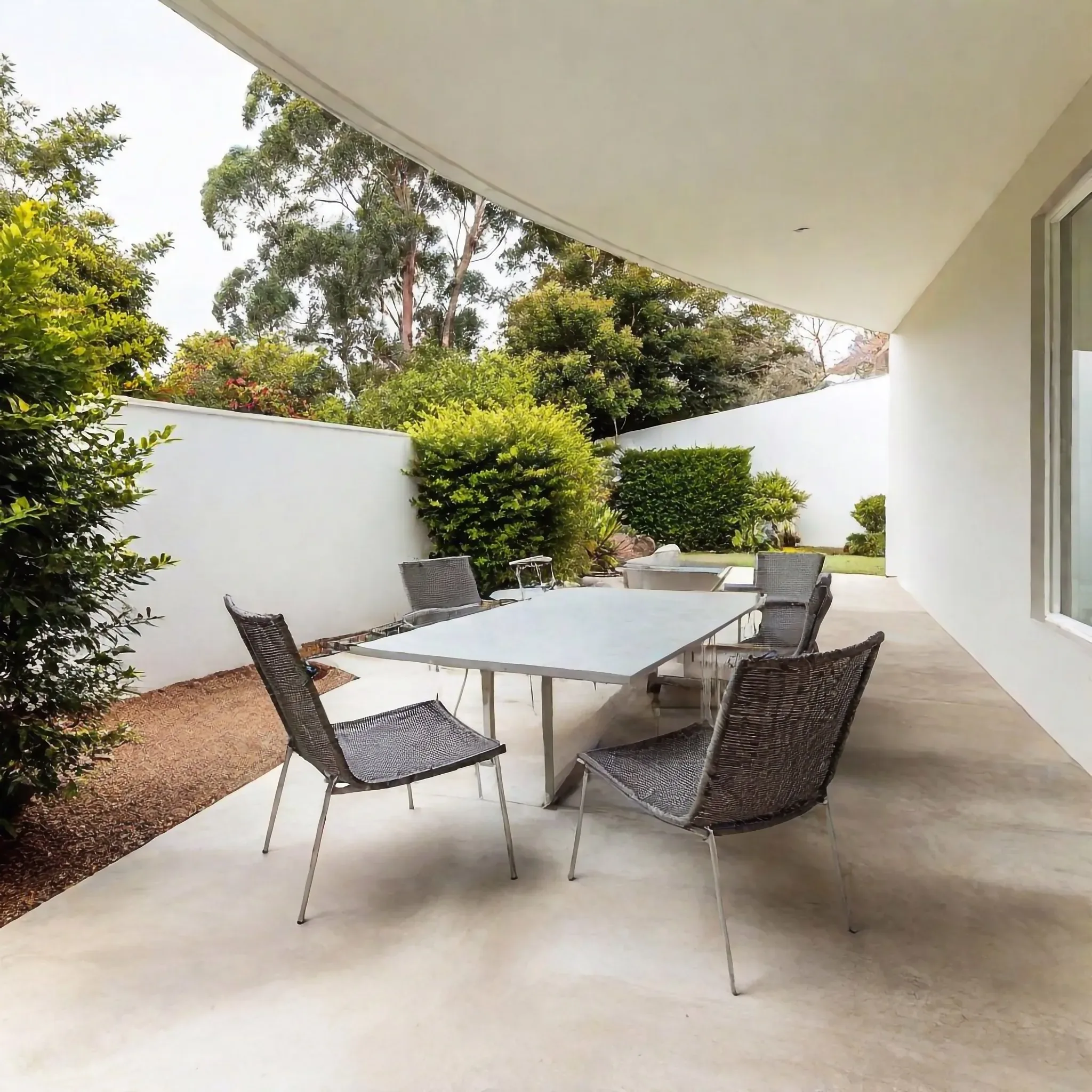 Concrete patio with outdoor dining setting