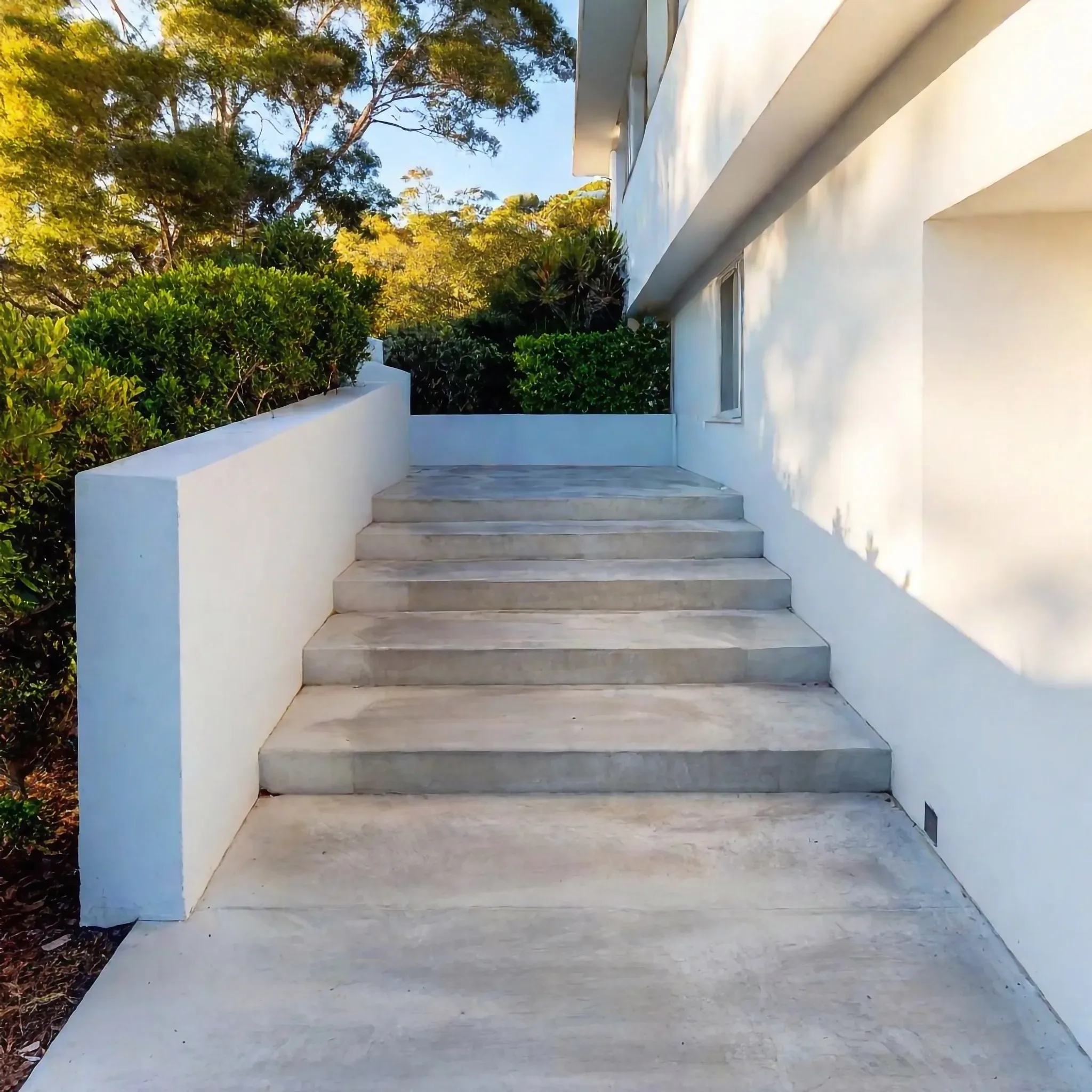 Concrete steps leading to a home entrance
