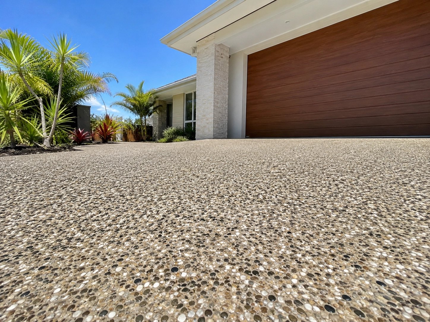 Exposed aggregate concrete driveway finish detail